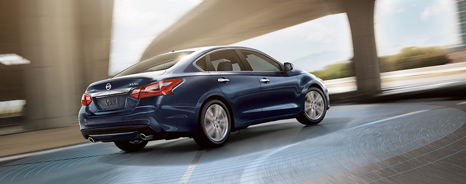 2018 Nissan Altima® sedan, rear side view, shown in Storm Blue