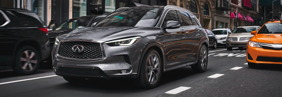 Front profile view of 2023 INFINITI QX50 Crossover SUV with left turn signal on