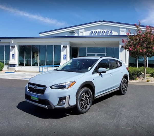 Front of dealership with Subaru